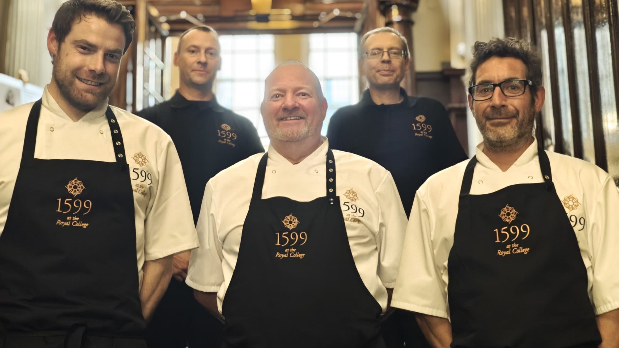 Chefs smiling with their new uniform